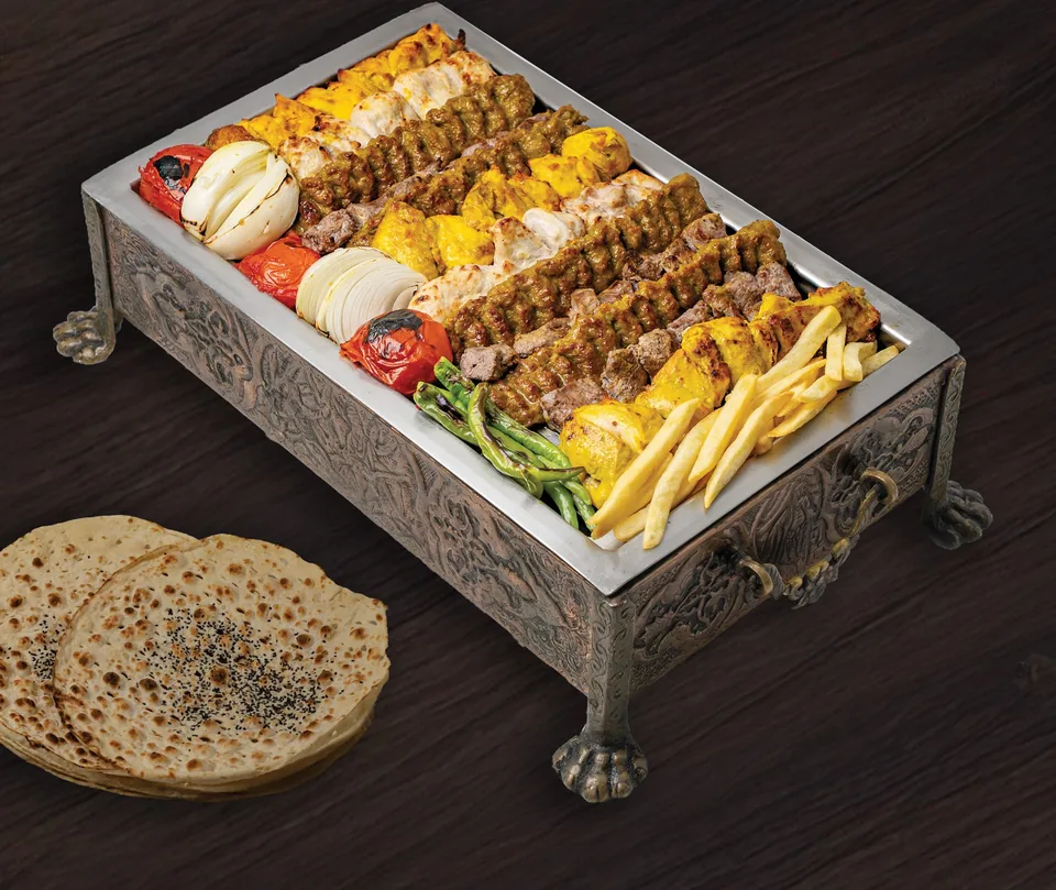 A Kish Persian grill selection presented in an ornate serving tray